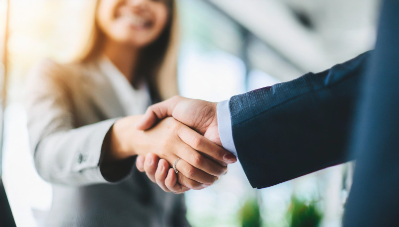 Two hands shake hands